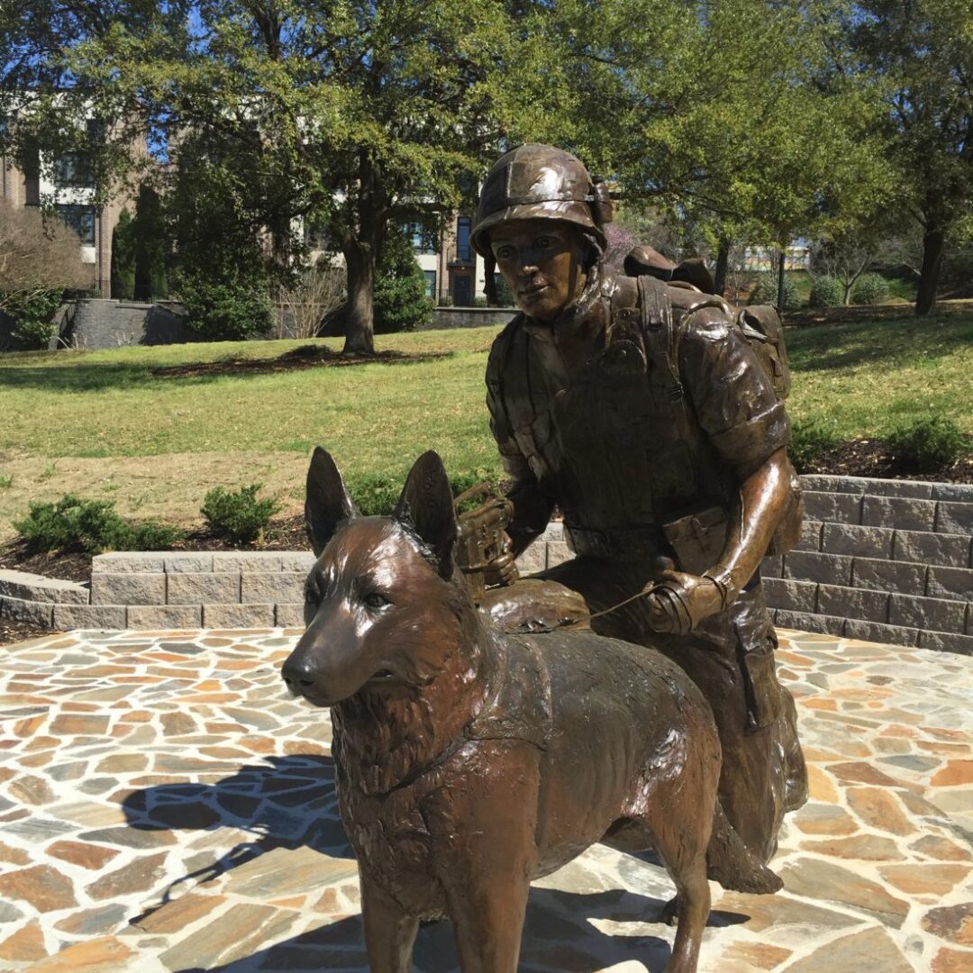 A Replica of a Soldier with a Dog